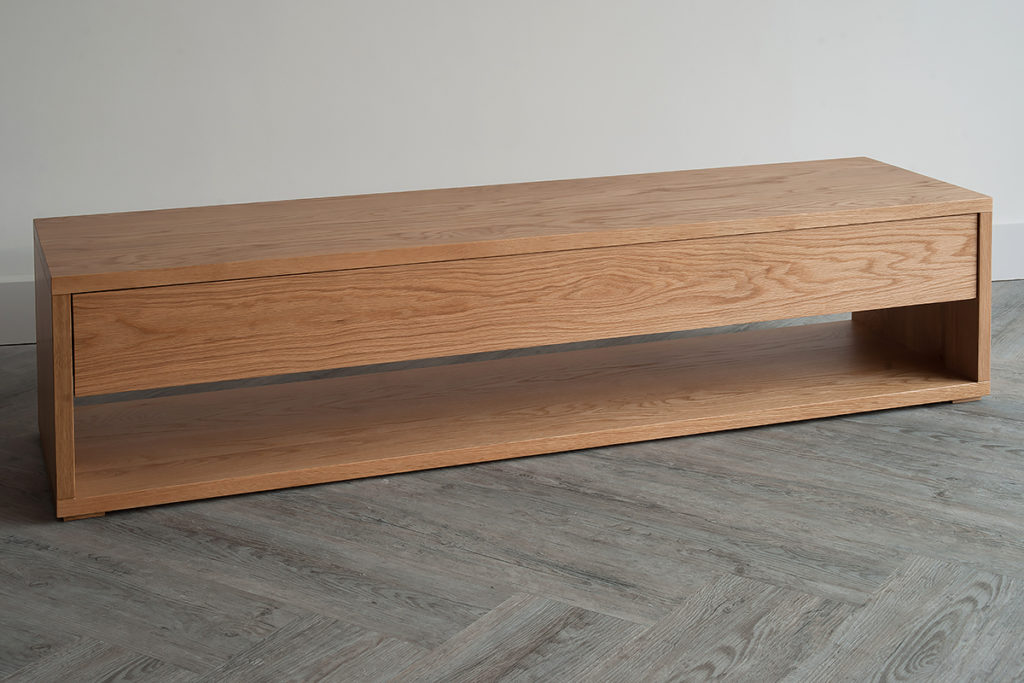 End of bed storage bench with drawer and open shelf in Oak.