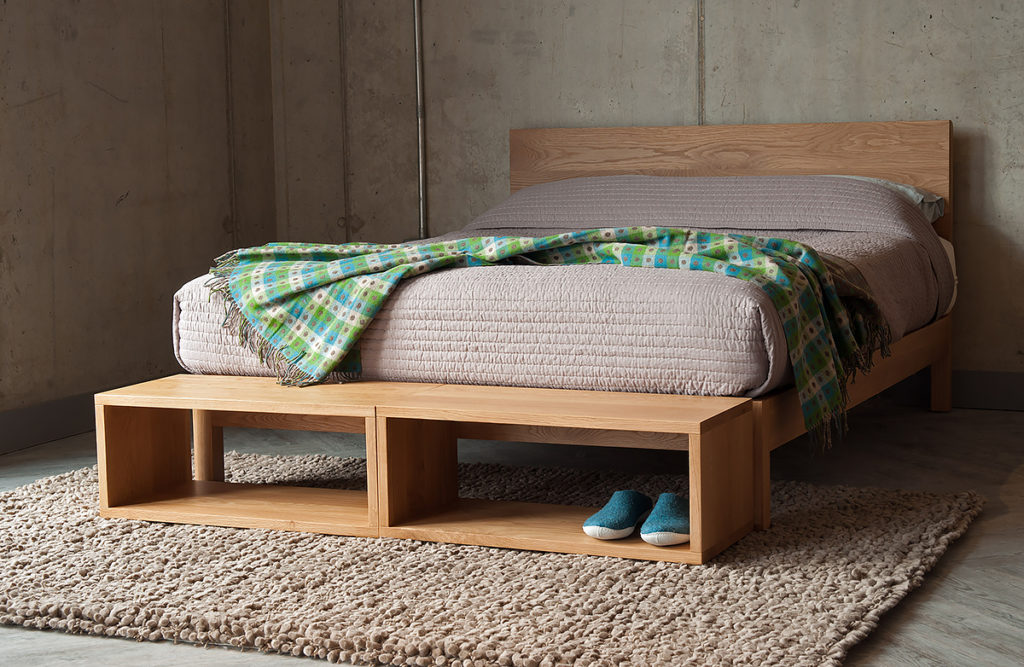 Black Lotus small open Cube tables as end of bed storage in Oak