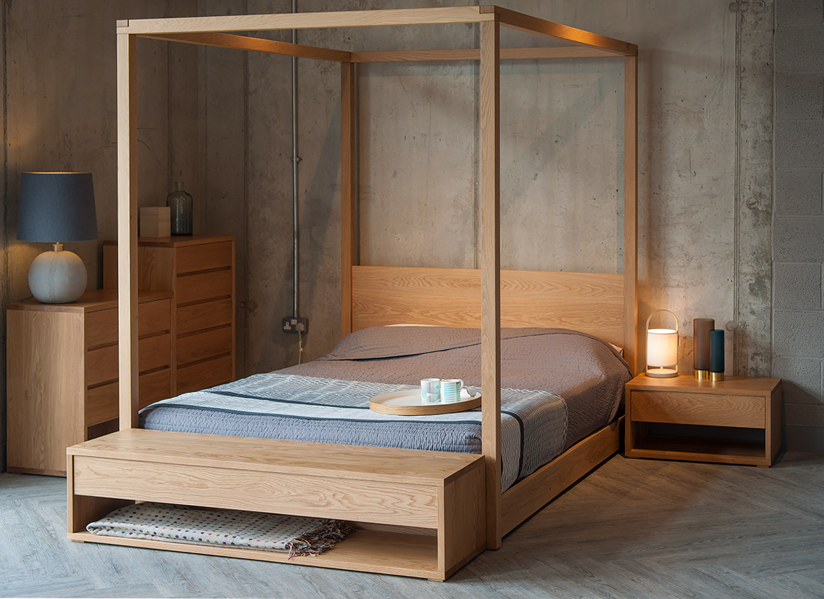 Industrial bedroom look with warm Oak furniture. Cube 4 Poster bed is the centrepiece, with Cube collection chests and an end of bed bench.