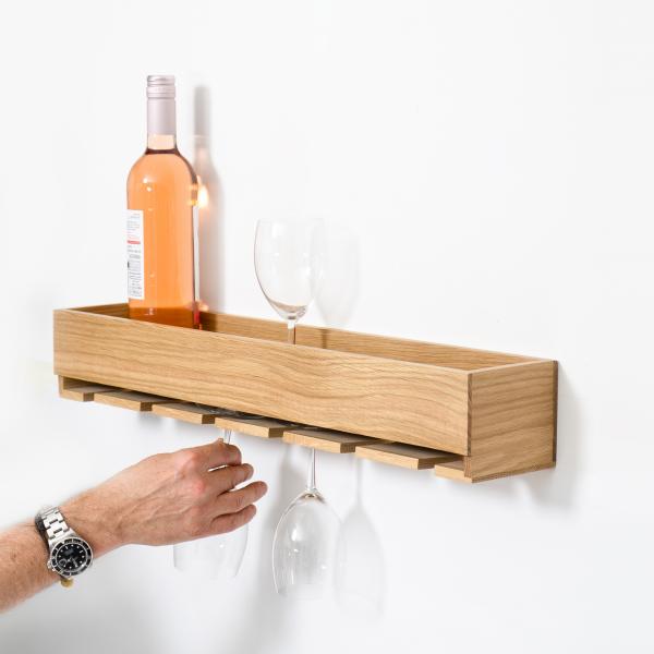 natural oak wall mounted wine glass holder and storage shelf shown in use