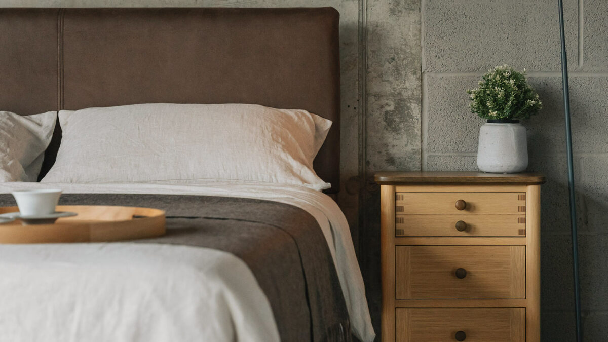 3 drawer bedside unit in oak with stained oak details