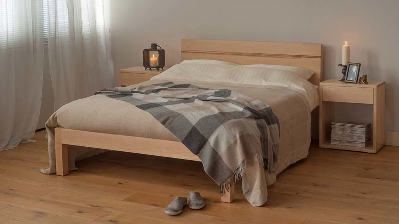 Chunky modern Tibet bed made from solid wood, here in Maple with Maple bedside Cube tables