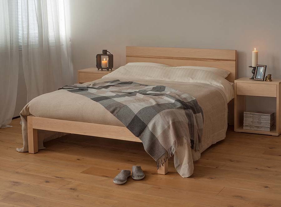 Chunky modern Tibet bed made from solid wood, here in Maple with Maple bedside Cube tables