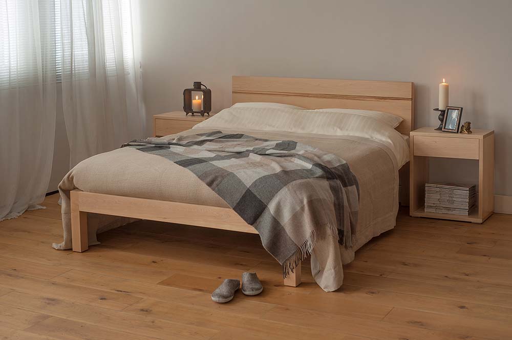 Chunky modern Tibet bed made from solid wood, here in Maple with Maple bedside Cube tables