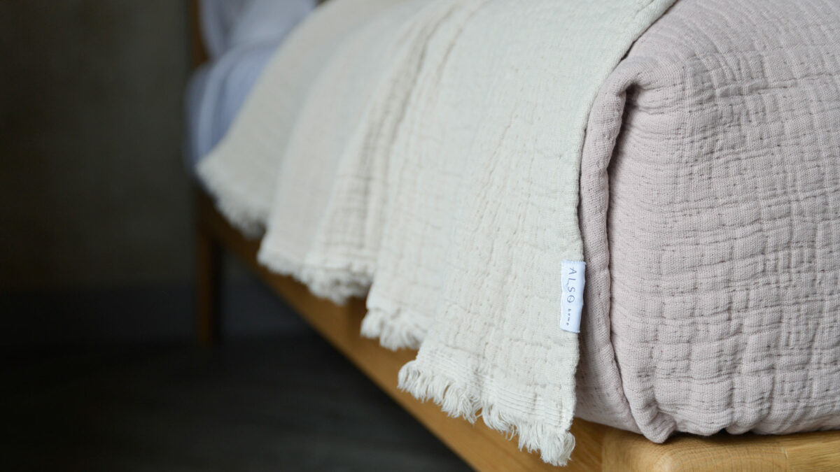 pure cotton crinkled effect throws up close and in white and blush pink