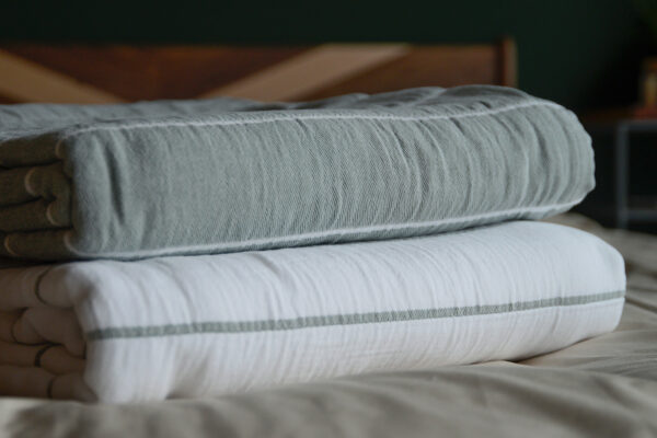 Jade and white striped cotton throws