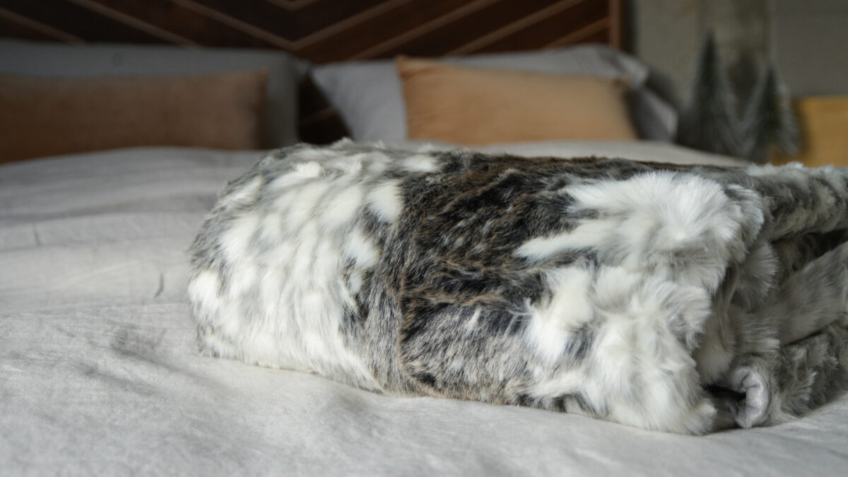 Softest faux fur throw in grey colours and white