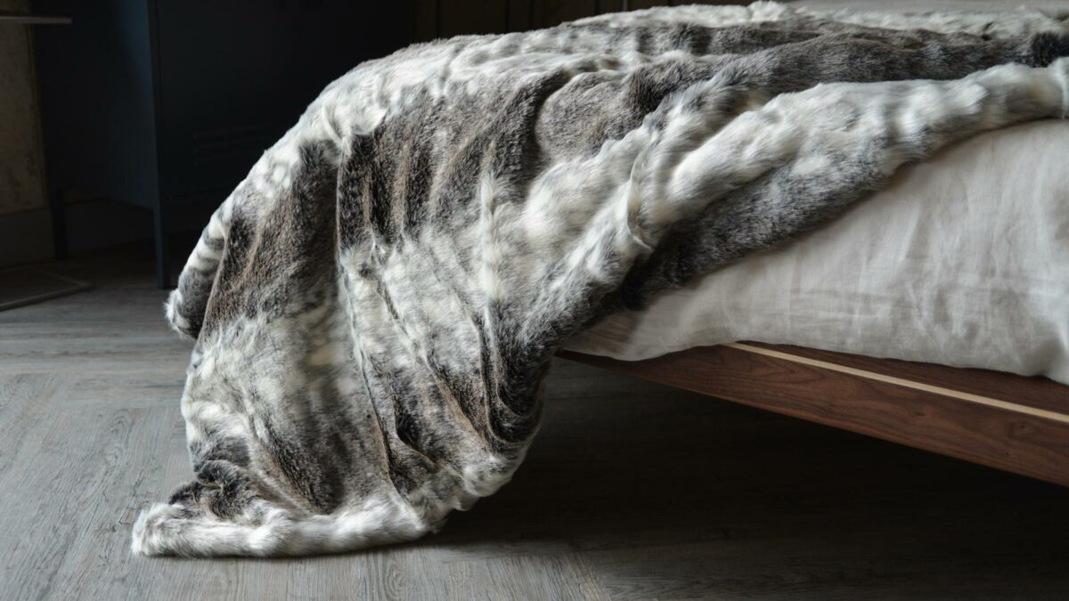 Softest faux fur throw in grey colours and white