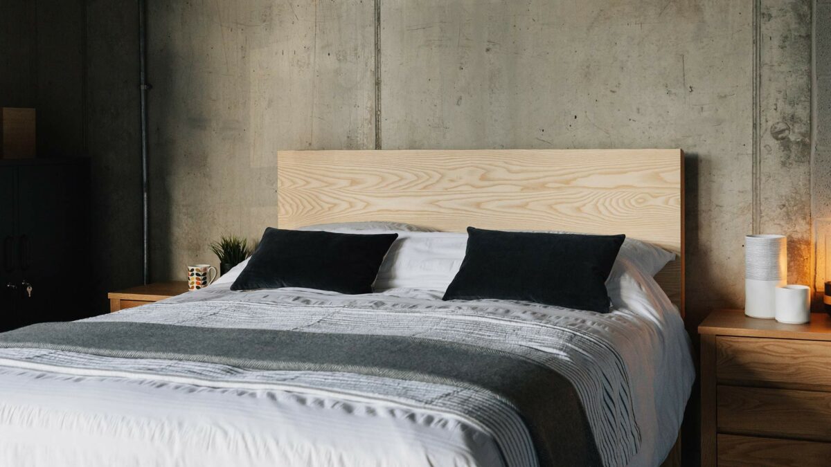 Bamford a chunky solid wood bed with a taller headboard here made from Ash