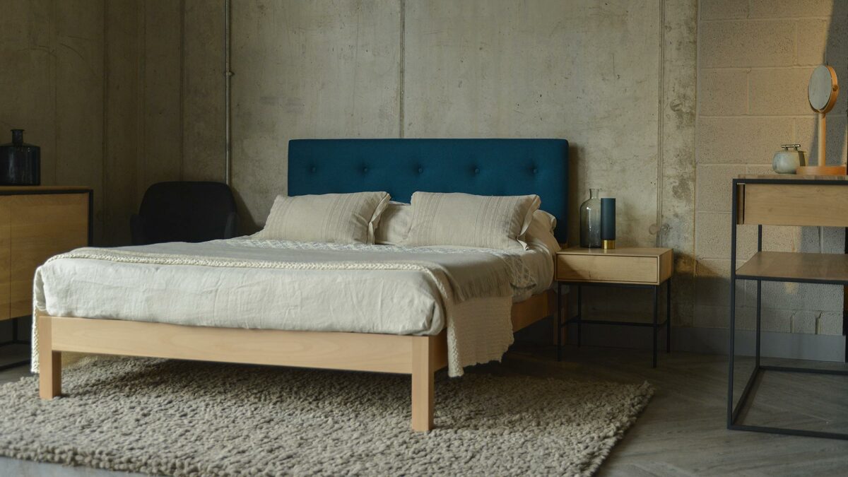 Beech Arran contemporary upholstered bed with Marine blue Amatheon fabric headboard