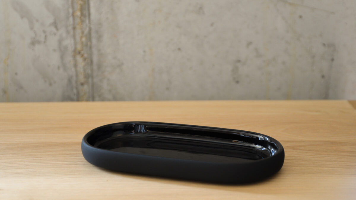 small ceramic dish with shiny upper and soft matt black under side