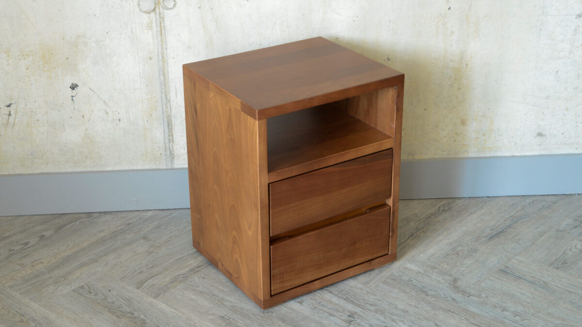 Angled photo of the Black Lotus 2 Drawer Shelf Table made from solid walnut.
