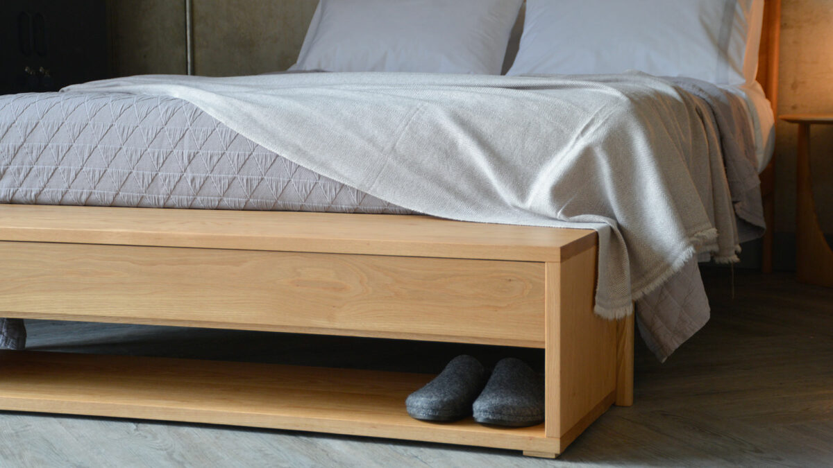 a closer view of our media unit or end of bed bench with storage drawer and open shelf, here in Oak