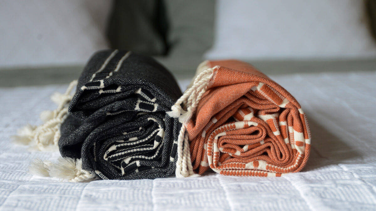 Boho style peshtemal throws in orange or black