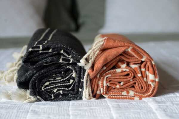 Boho style peshtemal throws in orange or black