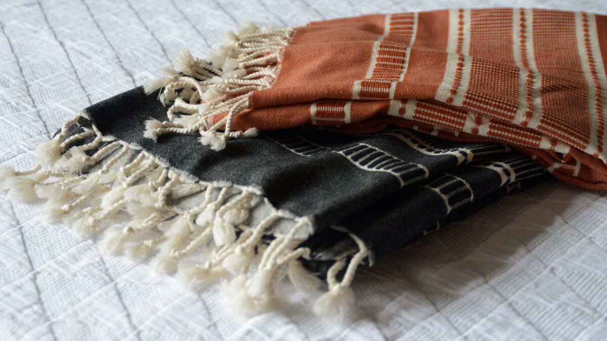 black and ivory, and brick red and ivory woven cotton peshtemal light weight throws