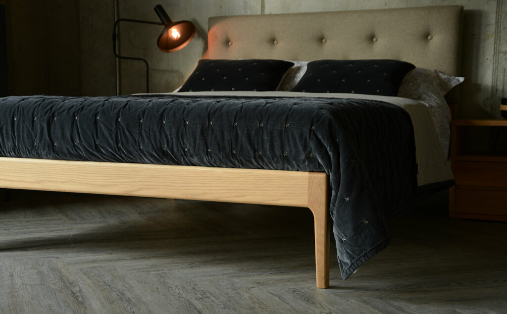 Bloomsbury upholstered solid oak bed with curved legs