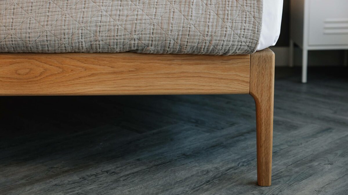 close-up pic of the curving solid wood Bloomsbury bed leg