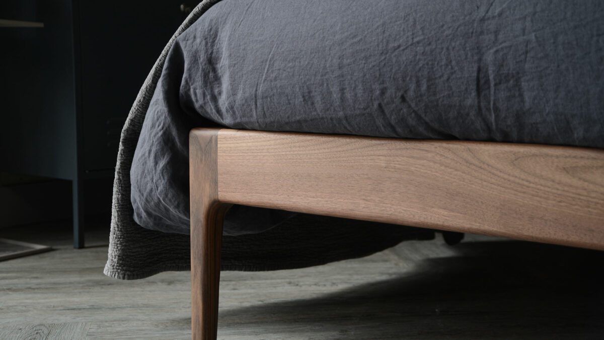 A closer view of the solid wood Bloomsbury bed leg, here in solid walnut