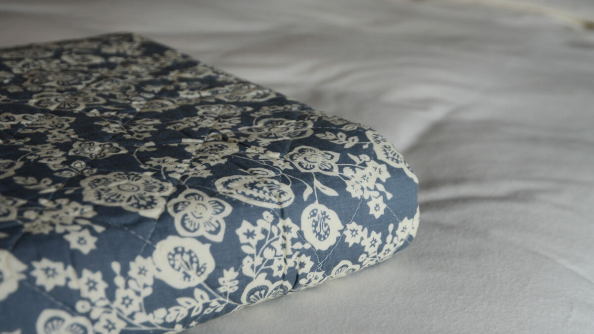 Blue and Cream Patterned Quilt