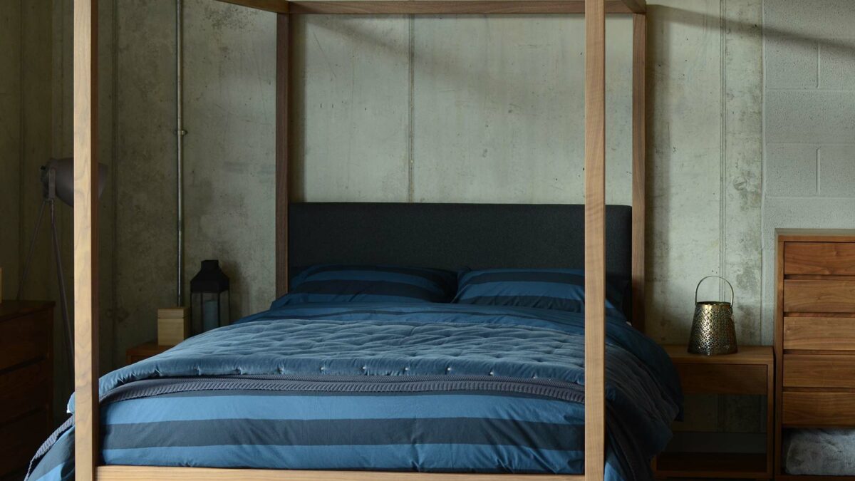 Blue bedding on our solid wood 4 poster bed with upholstered headboard, The Highland