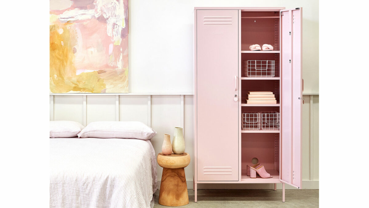 wardrobe storage locker in blush pink shown with one door open