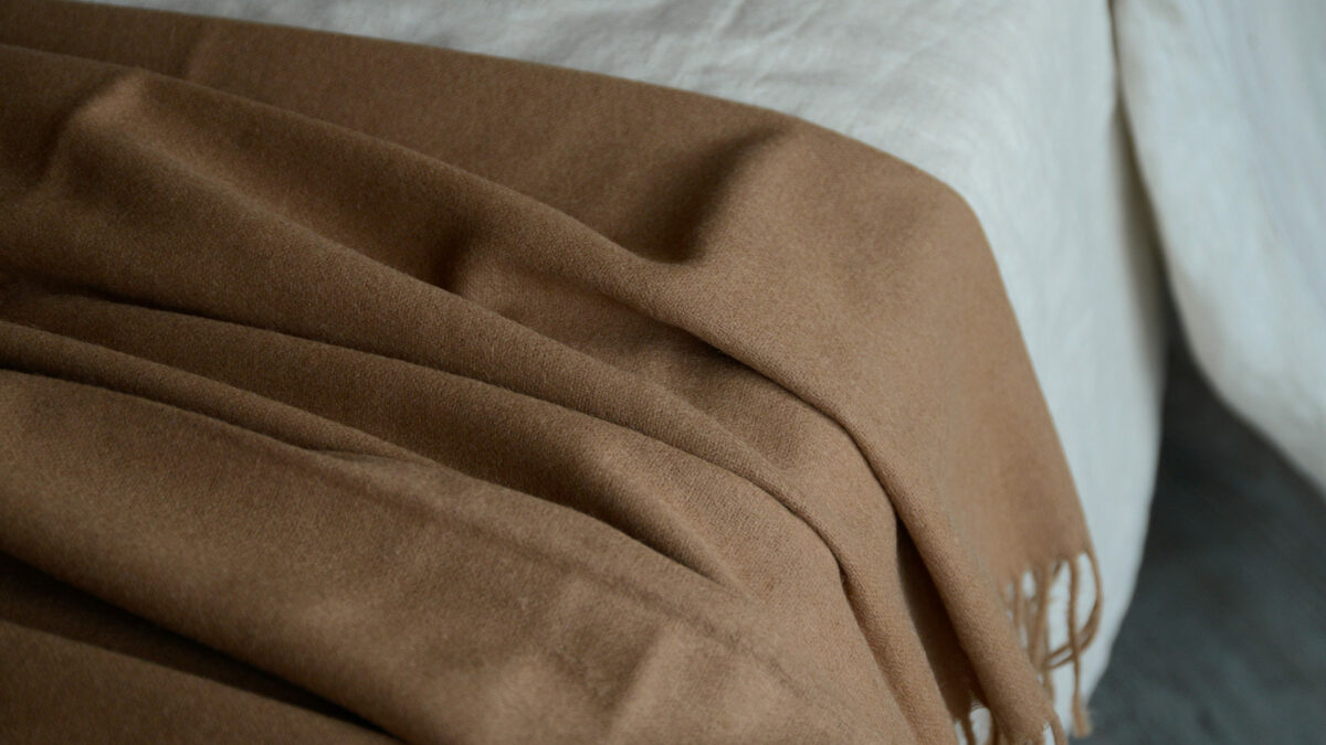 caramel coloured large wool throw shown close up