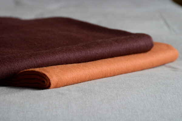 90% recycled Alpaca/wool mix throw in orange or plum