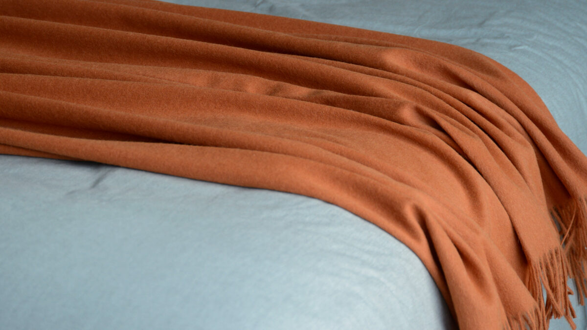 90% recycled Alpaca/wool mix throw in orange