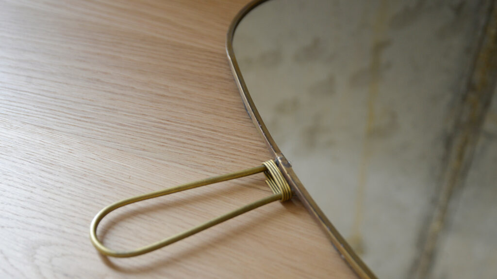 brass metal framed mirror to hang or hold