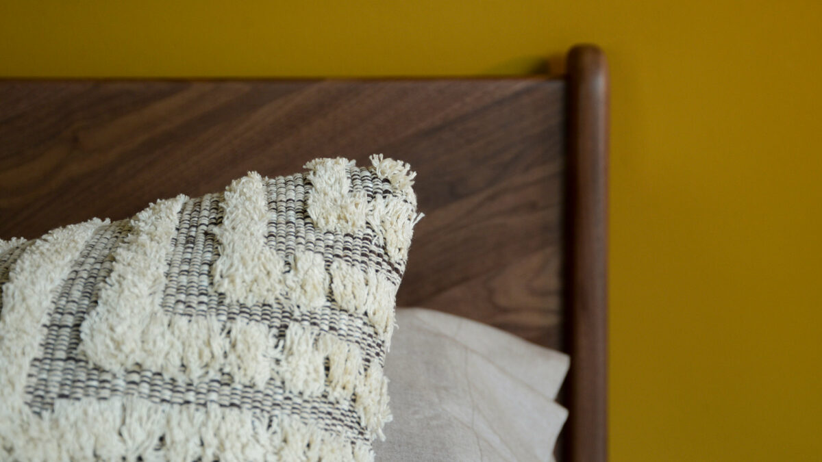 Tufted and textured cotton cushions in a brown and cream design a close up look