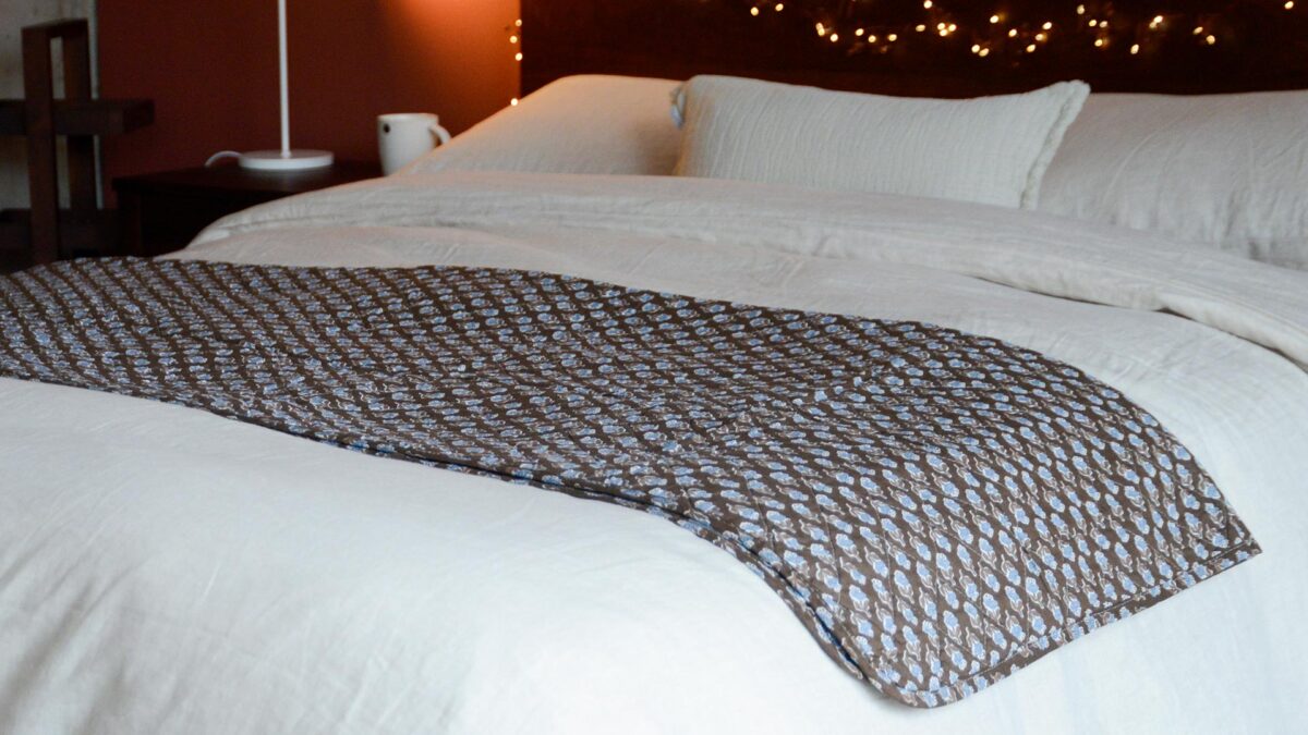 Brown Quilted Throw with Blue Flowers on Smoked Walnut Malabar