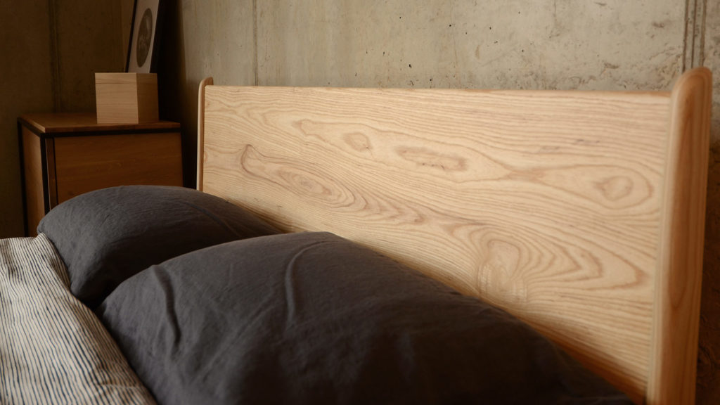 Headboard shot of the Mid-century style wooden Camden bed here in Ash