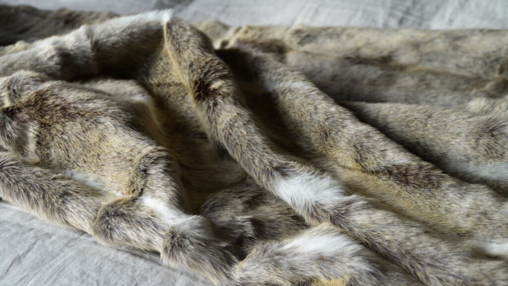 Softest faux fur throw in caramel colours and white