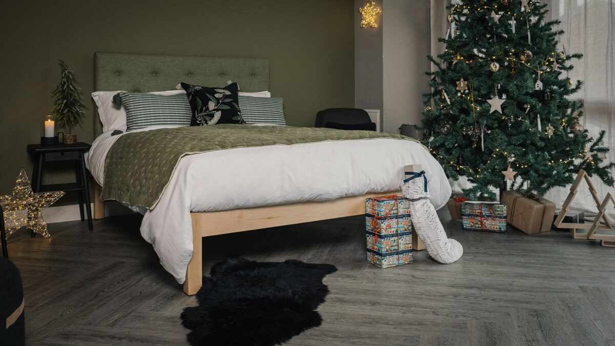 Xmas bedroom with green wool upholstered Skye bed