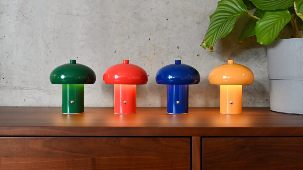 Collection of small, rechargeable retro style lamps in four different colours; green, red, blue and yellow.