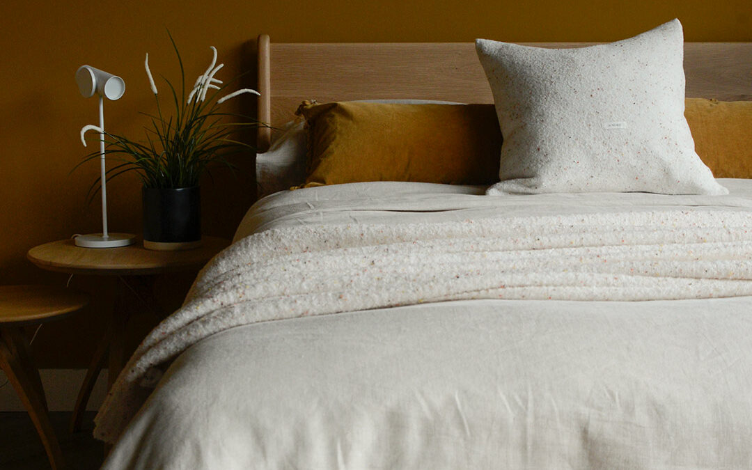 Cosy Flecked Cushion Cover on Oak Hoxton with Ochre Wall PORTRAIT