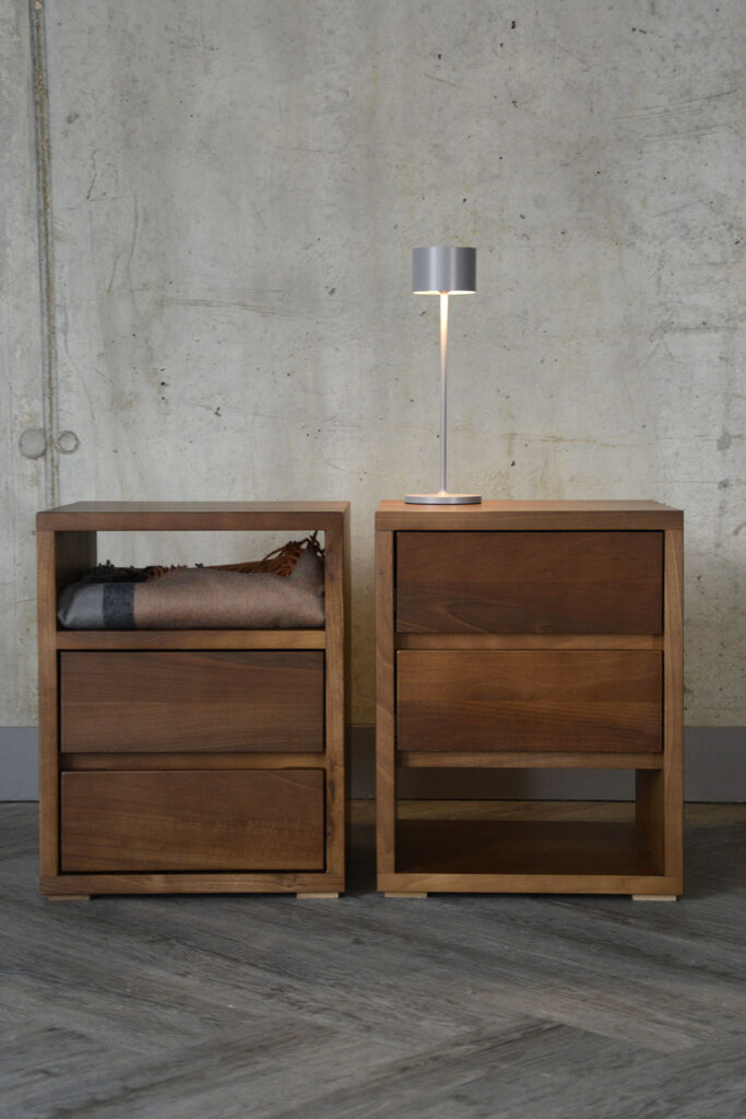 Front view of the Black Lotus two drawer units, demonstrating the two options available. To the left, you can see the bedside table with a shelf above the two drawers, whereas the right shows the unit with the drawers at the top and a shelf to the bottom.