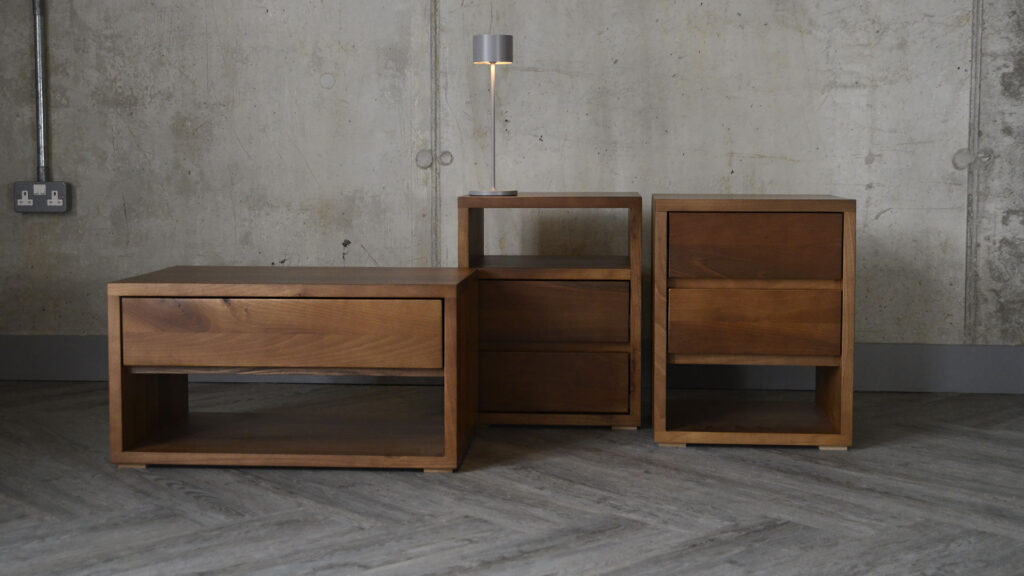 Image showing various matching furniture items from the Black Lotus Cube range. From left to right, you can see the one drawer low bedside unit, the two drawer unit with upper shelf and the two drawer unit with lower shelf.