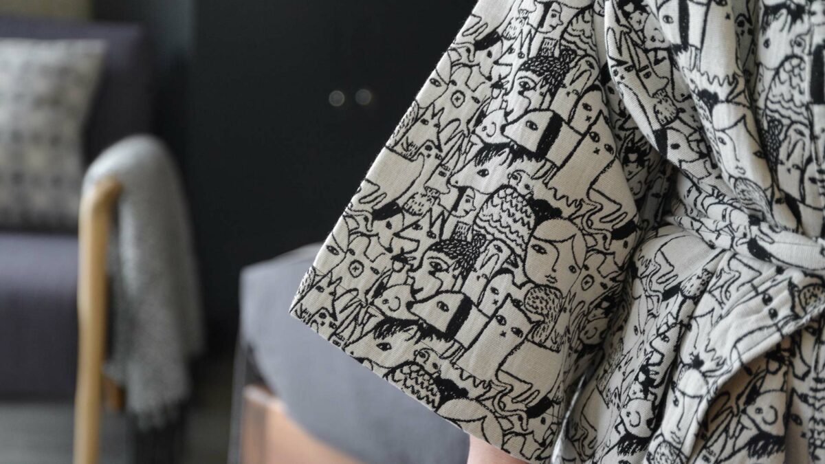 Donna Wilson black and white woven characters design robe, a close up view