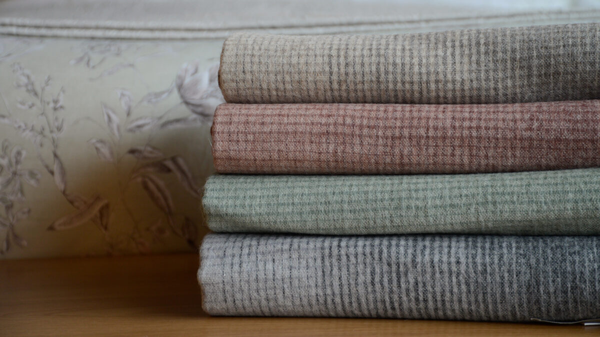 Alpaca and recycled wool gradient design throws in 4 colours