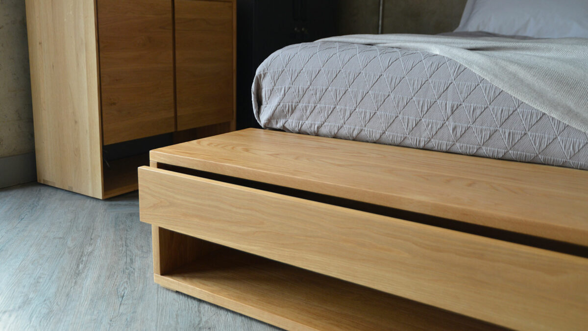 end of bed Oak bench showing open storage drawer and base shelf