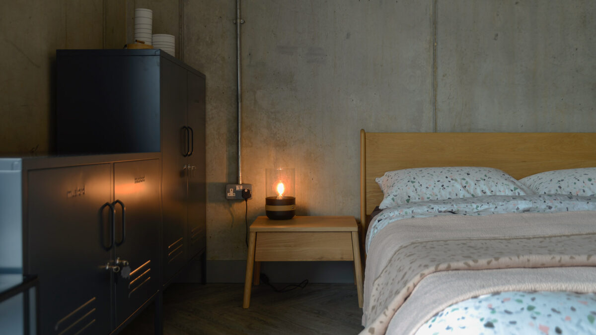 Air oak bedside drawer table next to our mid-century style low Carnaby bed.