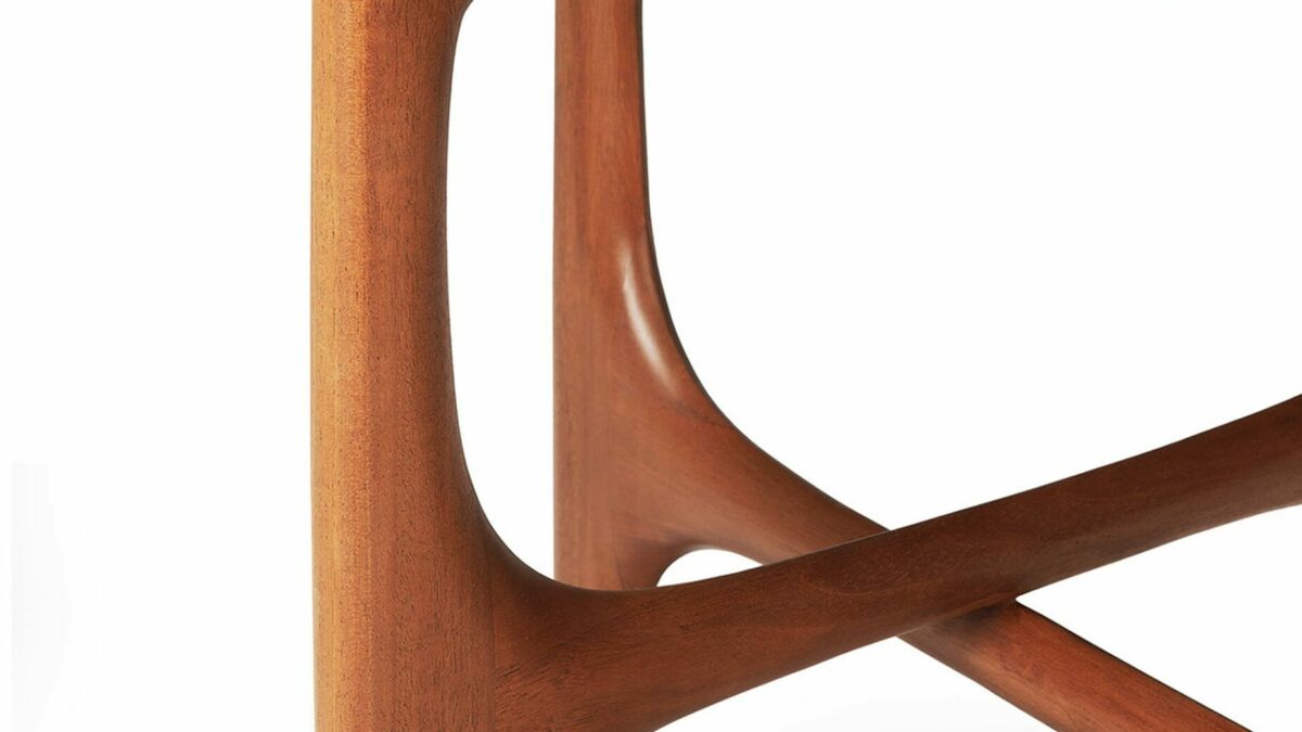 detail shot of the mahogany side table with its midcentury style curves