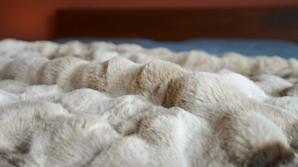 close up of faux fur bubble throw.