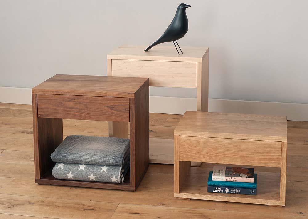 Bedside tables with a drawer and open shelf, available in a range of woods and in a choice of 3 heights.