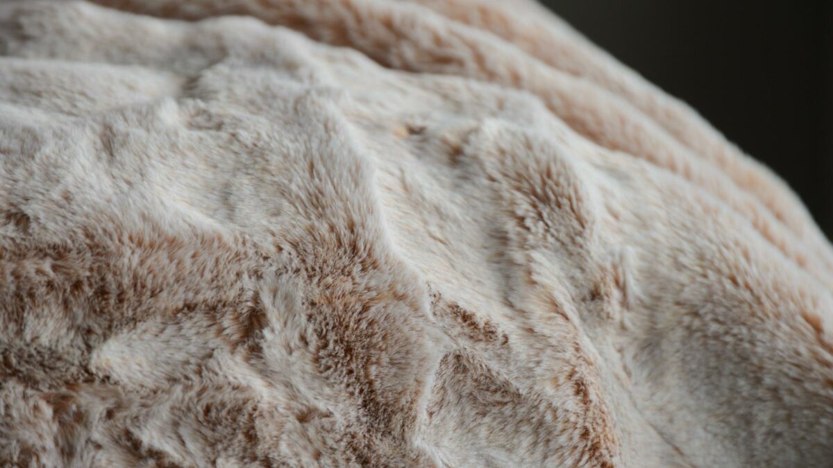 Detail view of the frosted pink faux fur throw