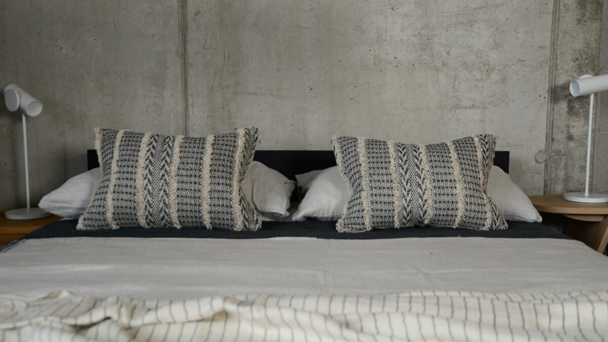 Geometric Boho Cushions with LED task lamps on Black Ash Kyoto