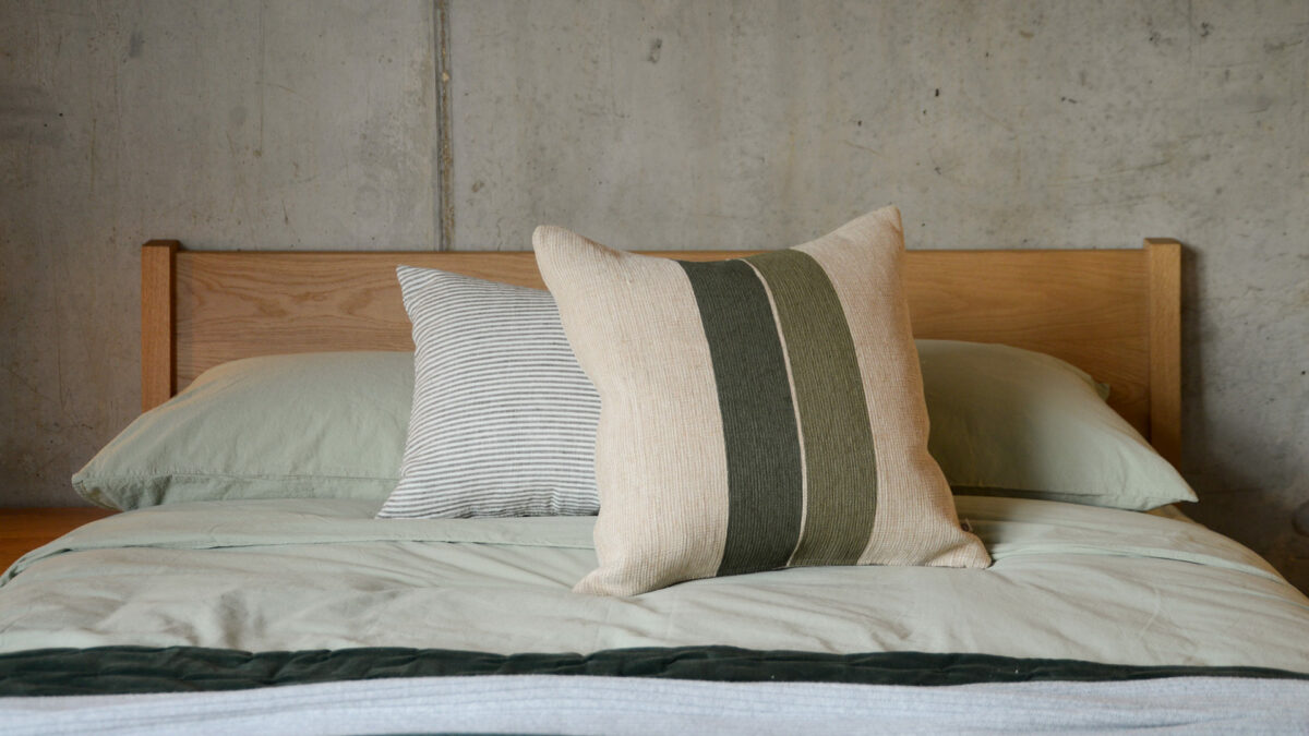 Green Stripe Jute Cushion Cover on Oak Zanskar