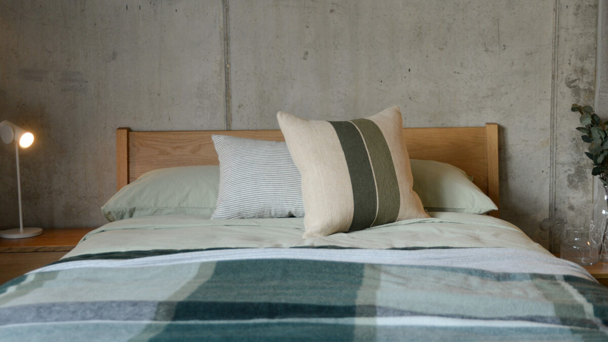 Green Stripe Jute Cushion Cover on Oak Zanskar with Green Bedding